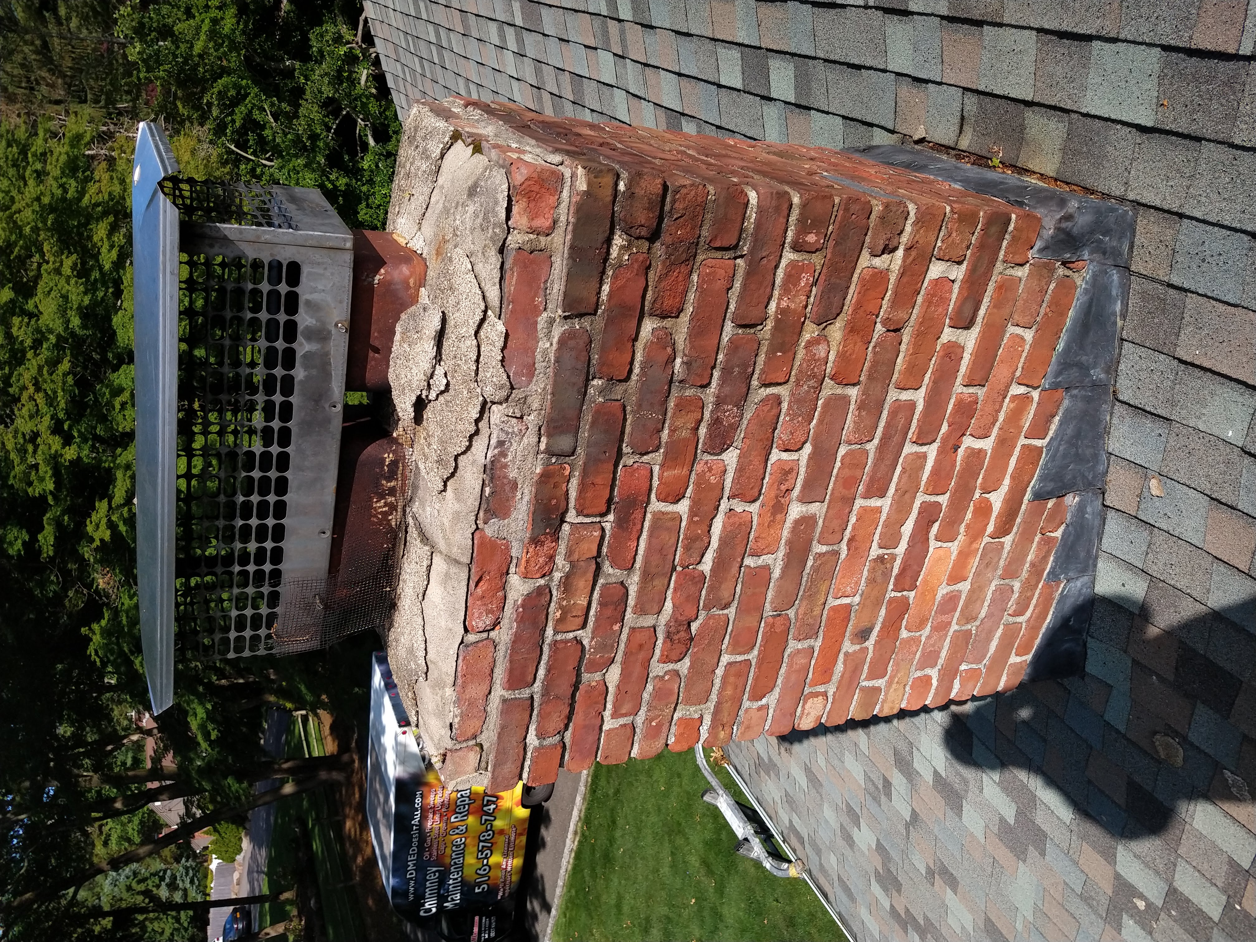 Cracked chimney crown professionally repaired in Garden City, New York